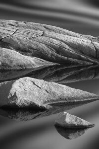 Black and white nature art of boulders above water in Nova Scotia by iCanvas artist Jeff Friesen