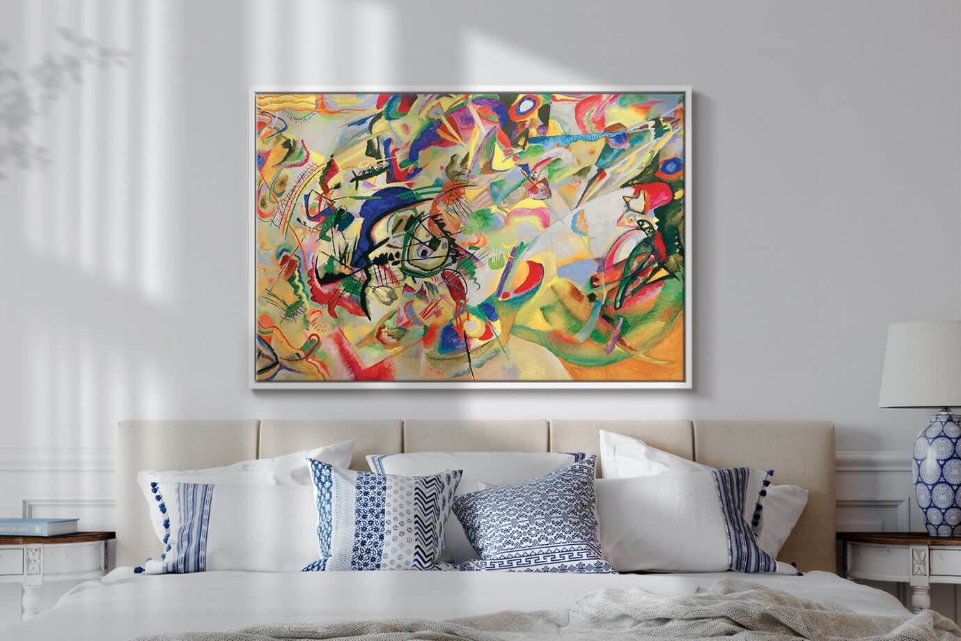 abstract kandinsky painting hanging above bed