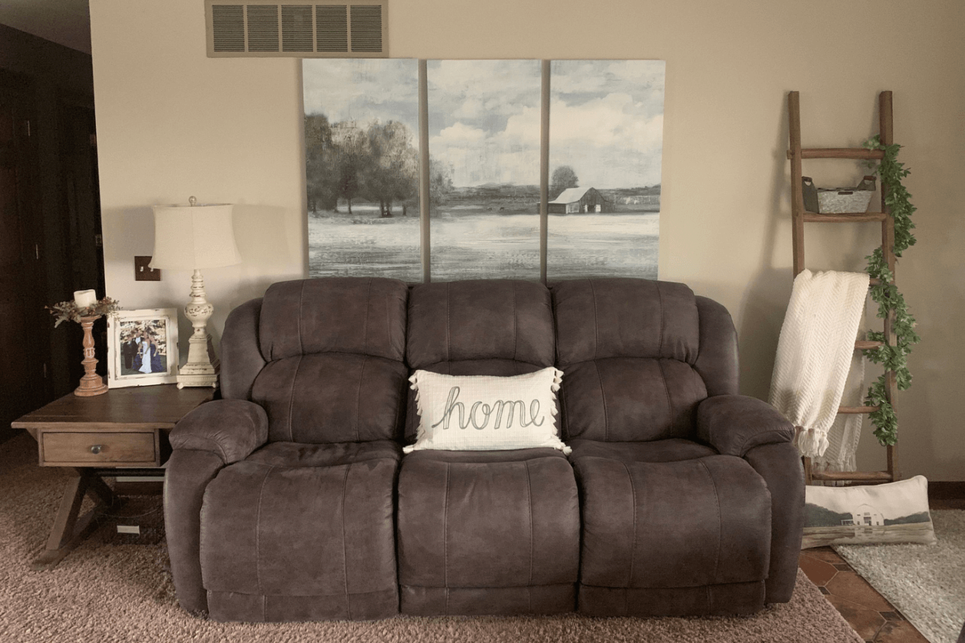 rural landscape art above couch