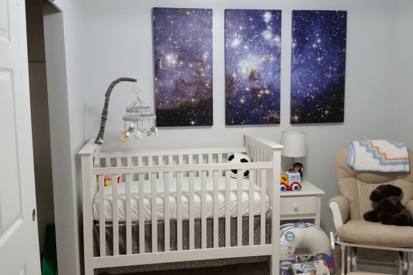 outer space art in baby's room