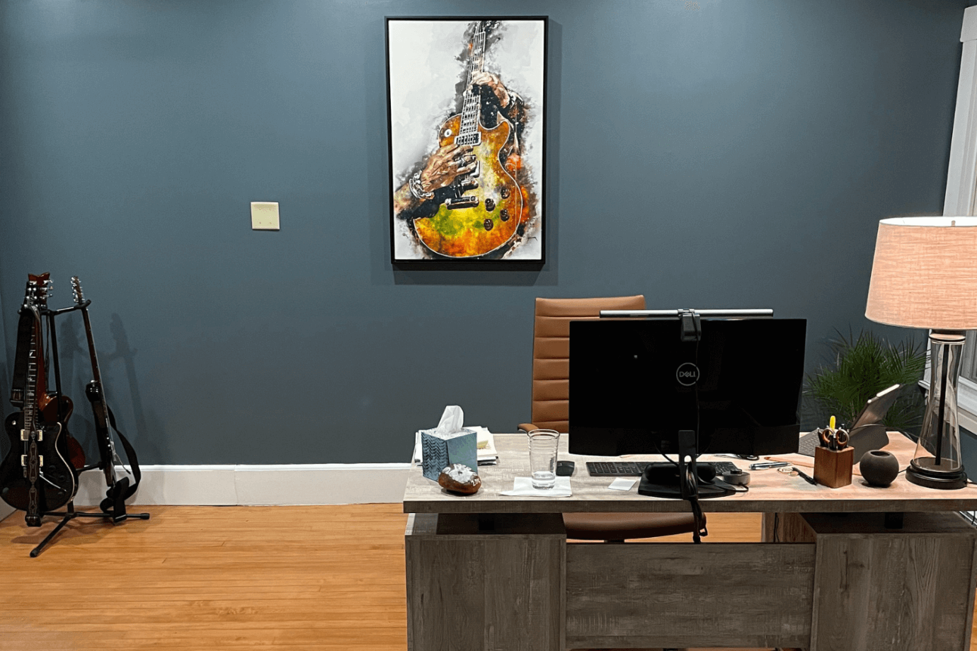 guitar artwork hanging on wall