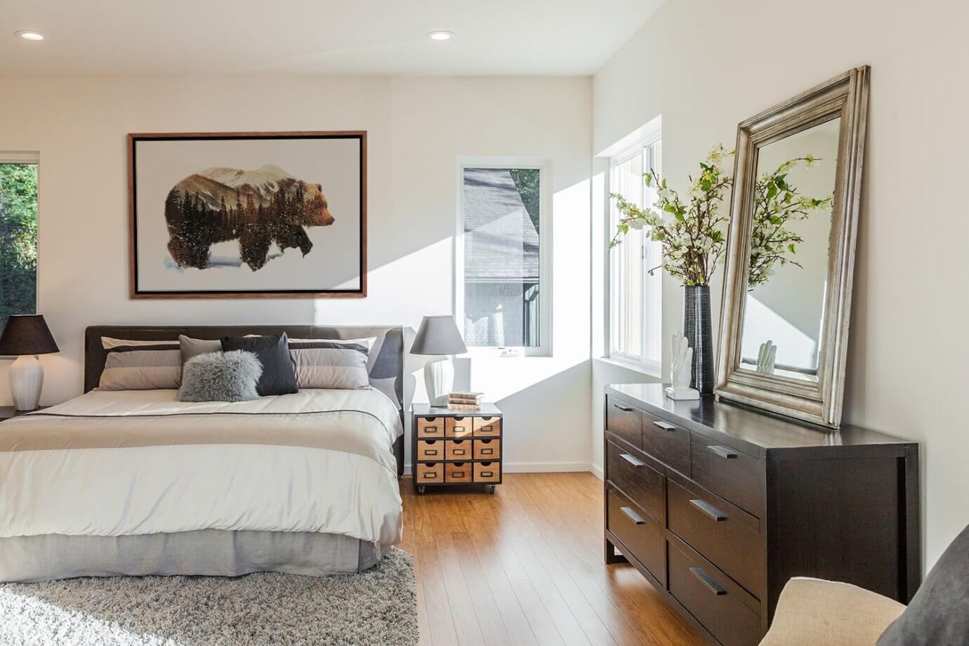 bear artwork above bed