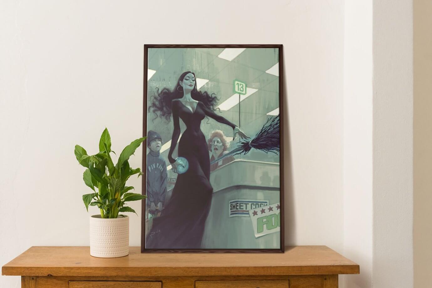 framed witch artwork on table