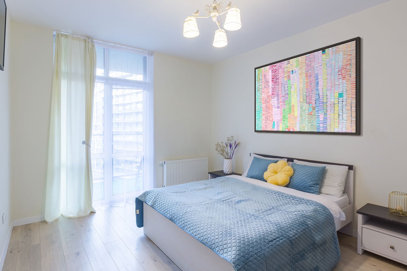 colorful abstract art above bed