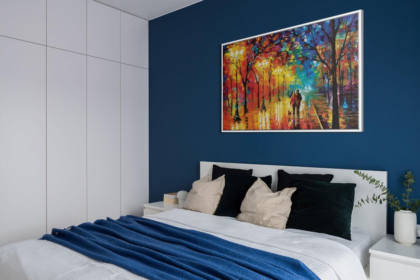 colorful forest art with couple walking hanging above bed