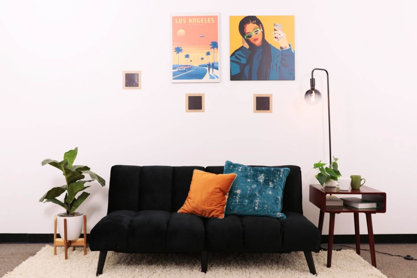 los angeles and rihanna artwork above couch