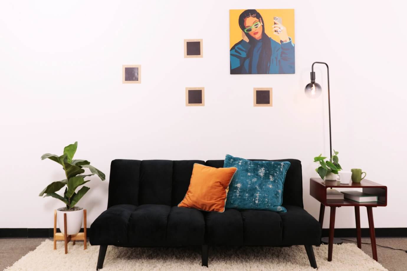 rihanna artwork above couch